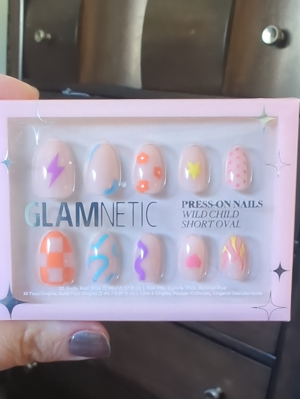 Short Oval Press-On Nails in Pastel Pink with Multicolor Designs